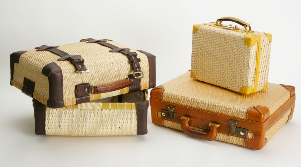 Three traditional Toyooka Kaban bags arranged neatly